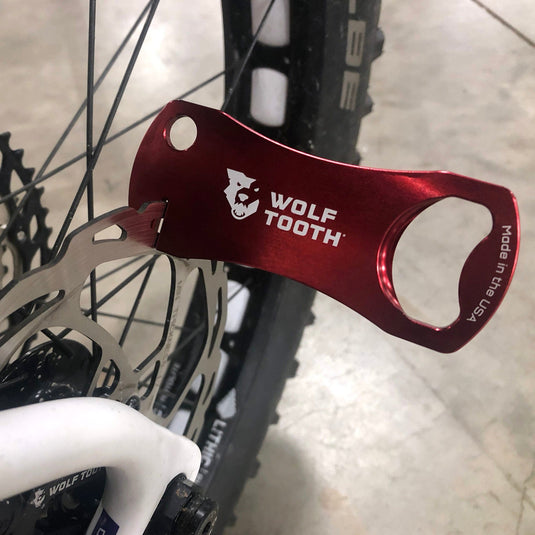 Wolf Tooth Bottle Opener With Rotor Truing Slot - Aluminum, Red, USA Made